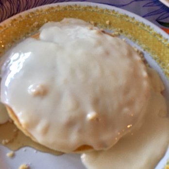 808 Grindz Cafe - Creamy sweet house sauce on top of the macadamia nut pancakes! - Cafes Near Me - Lahaina, Hawaii