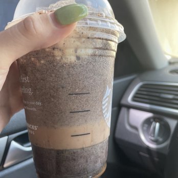Starbucks - a hand holding a cup of coffee - Coffee & Tea Near Me - Metairie, Louisiana Starbucks - a hand holding a cup of coffee - Coffee & Tea Near Me - Metairie, Louisiana