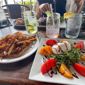 Cork Soakers Deck and Wine Bar - Skin on French fries (yum) and burrata & tomato salad - Wine Bars Near Me - Cape Coral, Florida Cork Soakers Deck and Wine Bar - Skin on French fries (yum) and burrata & tomato salad - Wine Bars Near Me - Cape Coral, Florida
