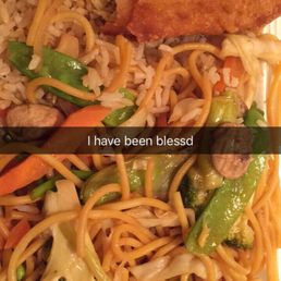 a plate of noodles with meat and veggies