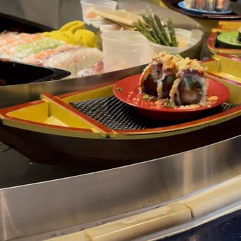 Blue Ginger - sushi boats on a water belt. - Japanese Near Me - Southwest Ranches, Florida Blue Ginger - sushi boats on a water belt. - Japanese Near Me - Southwest Ranches, Florida