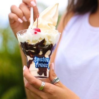 Wienerschnitzel - a woman holding a cup of ice cream - Fast Food Near Me - Apple Valley, California