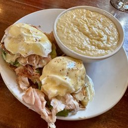 Smoked turkey and avocado eggs benedict with cheddar grits Smoked turkey and avocado eggs benedict with cheddar grits