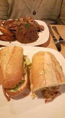 Photo of Geo's Cuban & Creole Cafe - Seattle, WA, US. Shrimp Po Boy and Palomilla Steak entree.