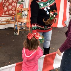 Sunrise Marketplace - My toddler playing a carnival game at the Frozen Winter Festival on Saturday!