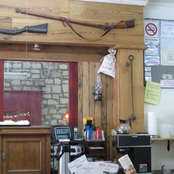Sarsaparilla Saloon & Cafe - a gun on the wall - American Near Me - Belton, Texas