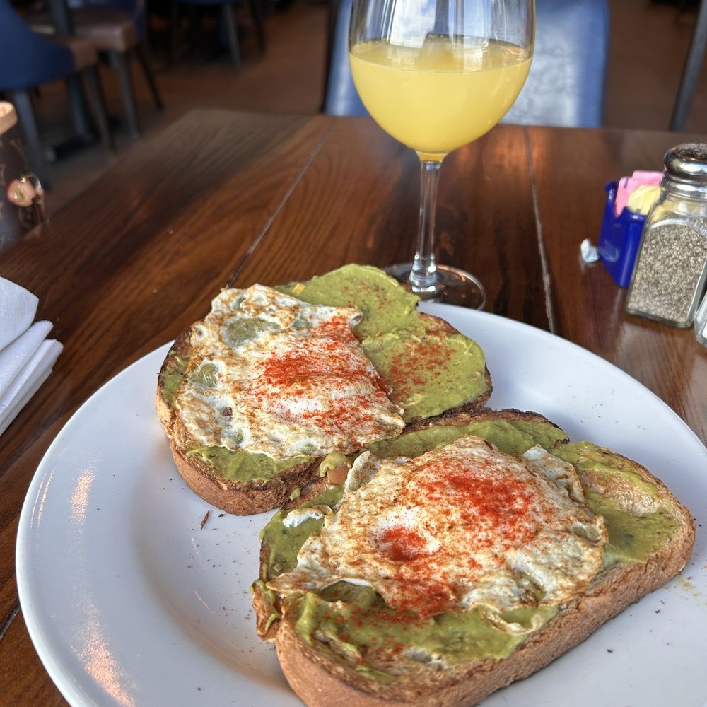 Blue Note - Avocado toast with mimosa - Sports Bars Near Me - St. Louis, Missouri