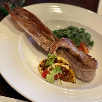 Ginger Bistro - Roasted Blue Fin Tuna, special part, with succulent bone and spiced lemon slices. Finger licking good. - Sushi Bars Near Me - St. Augustine, Florida