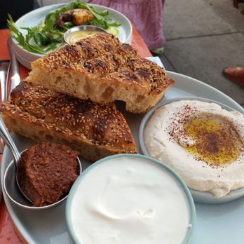 Kismet - Berberi Bread with labneh Schoug and tahini - Mediterranean Near Me - Los Angeles, California Kismet - Berberi Bread with labneh Schoug and tahini - Mediterranean Near Me - Los Angeles, California