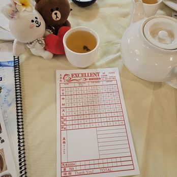 Excellent Cuisine - Workers will stamp this card as customers take baskets of dimsum from rolling carts... - Dim Sum Near Me - Portland, Oregon Excellent Cuisine - Workers will stamp this card as customers take baskets of dimsum from rolling carts... - Dim Sum Near Me - Portland, Oregon