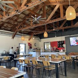 Acre Pizza - Expansive dining area--love the rustic vaulted ceiling with beams