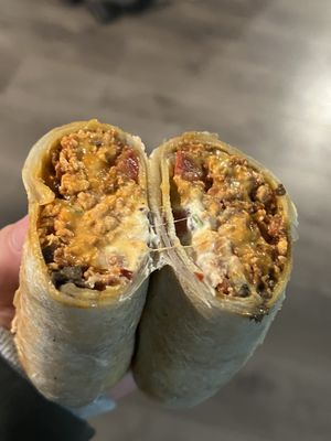 Photo of La Osita - Portland, OR, US. La osita breakfast burrito, chorizo, cheese, sour cream, beans, very fulfilling for one person!