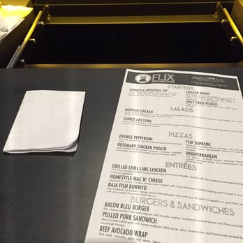 Flix Brewhouse Carmel - Trays pulled all the way out so it reaches your seat.  Really cool and better IMO than the trays at Studio Movie Grill. - Cinema Near Me - Carmel, Indiana