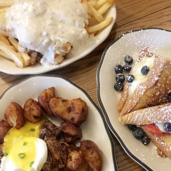 Eggy's Diner Chicago - Breakfast poutine in the back, eggy's Benedict on the left, stuffed French toast on the right - Breakfast & Brunch Near Me - Chicago, Illinois
