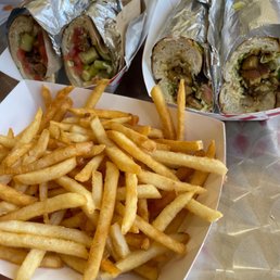 a plate of french fries and a sandwich