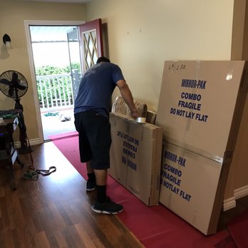 Sullivan Moving & Storage - Carefully wrapping my antique picture frames - Movers Near Me - San Diego, California Sullivan Moving & Storage - Carefully wrapping my antique picture frames - Movers Near Me - San Diego, California