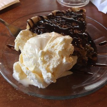 Butterburrs - Oatmeal Pie with chocolate drizzled over it and vanilla ice cream. - Breakfast & Brunch Near Me - Pocatello, Idaho Butterburrs - Oatmeal Pie with chocolate drizzled over it and vanilla ice cream. - Breakfast & Brunch Near Me - Pocatello, Idaho