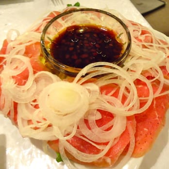 Maile's Thai Bistro - Beef Sashimi ($12.90): Thinly sliced beef & onions, served w/chopped romaine. The chili soy sauce has Sriracha in it. - Thai Near Me - Honolulu, Hawaii