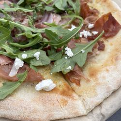 Saco River Brewing Taphaus - Saco Special Pizza Creamy garlic sauce topped with sliced porchetta, prosciutto, crumbled goat cheese, sautéed red onion, fresh arugula.