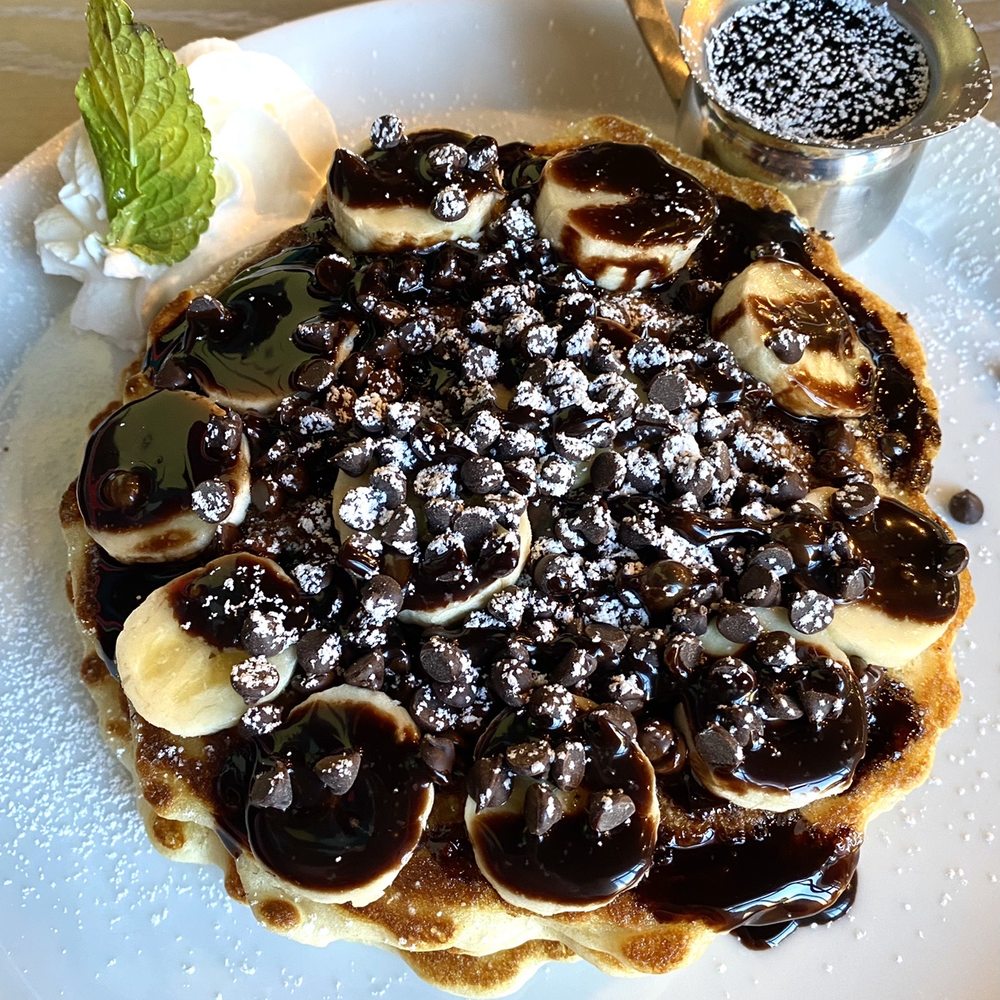 The Hen - Chocolate chip and banana pancakes (3 stack) - Breakfast & Brunch Near Me - Ann Arbor, Michigan The Hen - Chocolate chip and banana pancakes (3 stack) - Breakfast & Brunch Near Me - Ann Arbor, Michigan