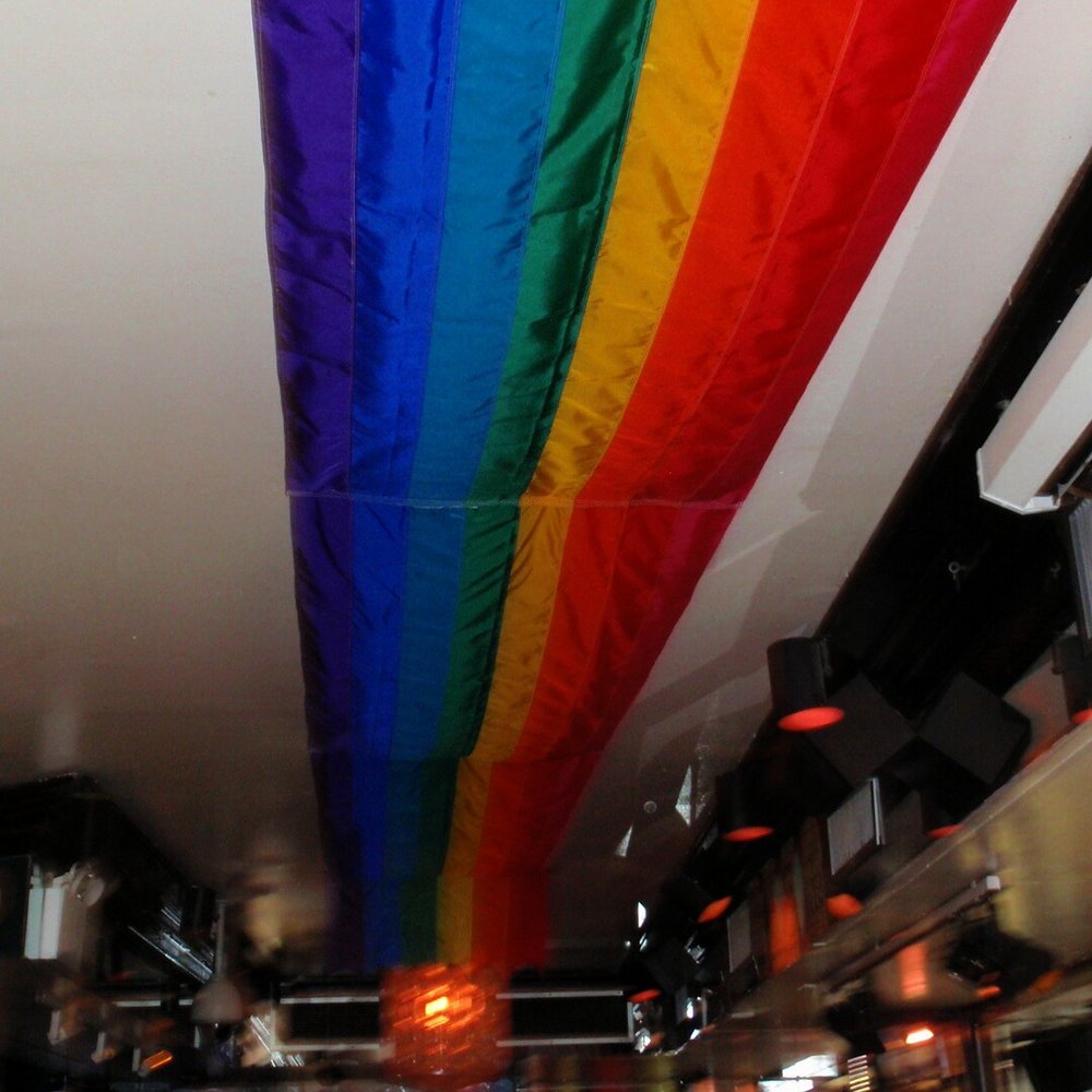 The Monster - Raibow banner over piano area on ground level - Gay Bars Near Me - New York, New York The Monster - Raibow banner over piano area on ground level - Gay Bars Near Me - New York, New York