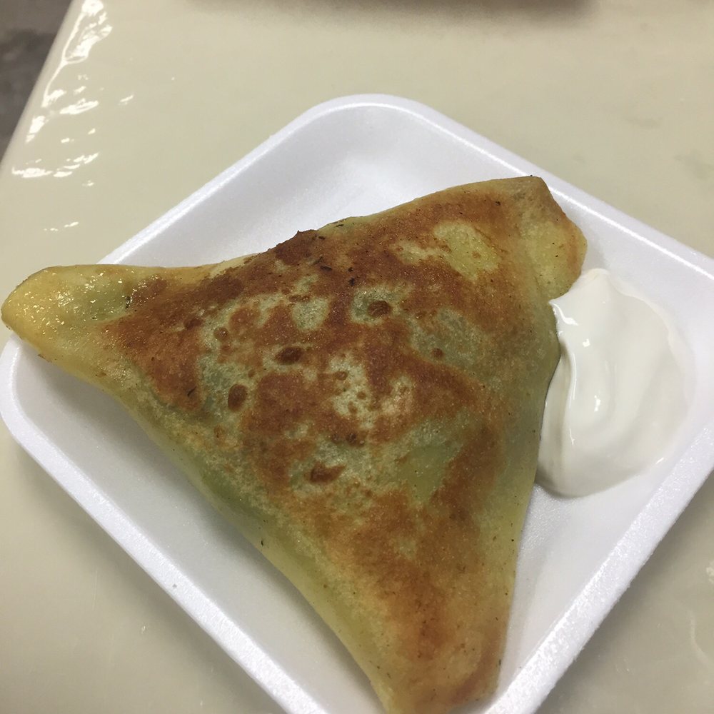 European Delight - Spinach And cheese blintz with dill and sour cream. - Delis Near Me - Toronto, Ontario