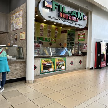 Fil-Am BBQ Grill - a woman standing in front of the counter - Filipino Near Me - Orange, California Fil-Am BBQ Grill - a woman standing in front of the counter - Filipino Near Me - Orange, California