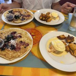 One order of salmon Benedict and fruit pancakes, split in two without asking!