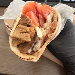 Simply Donairs - Regular Beef Donair. Tomatoes, onion, banana peppers and sweet sauce. Latex gloves are a must when eating donairs.
