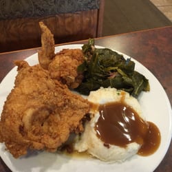 Fried chicken with mashed potatoes and greens