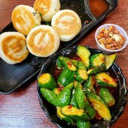 Free peanut starter, marinated cucumbers, pork pan fried bao Free peanut starter, marinated cucumbers, pork pan fried bao
