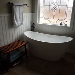 Omar's Home Improvement - New tub, flooring, and wainscoting.