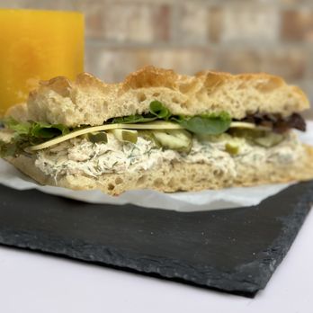 Mama Fontana - a chicken salad sandwich with a glass of orange juice - Bakeries Near Me - Houston, Texas