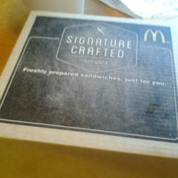 McDonald's - Here's the sandwich box to the Signature Sriracha Sandwich.  The box design seems simple, but notice the variances of printed letters on it. - Coffee & Tea Near Me - Barstow, California