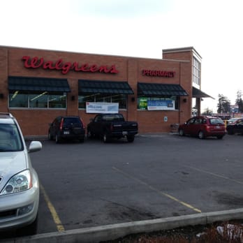 Walgreens - cars parked in front of a walgreens store - Drugstores Near Me - Spokane, Washington
