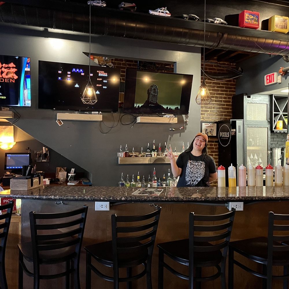 Pixels Pints & Bytes - a woman behind the bar - New American Near Me - Norfolk, Virginia Pixels Pints & Bytes - a woman behind the bar - New American Near Me - Norfolk, Virginia