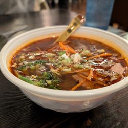 Dumpling Cafe - Hot and Sour sweet potato noodle soup with beef. Best hot and sour soup I have ever tasted.
