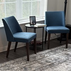 Janesville Comfort Shoppe - Accent chairs tying color with rug and the rest of the room.