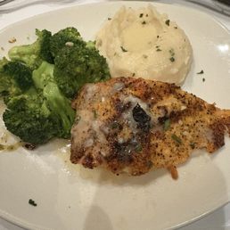 Delicious salmon, mashed potatoes, and broccoli