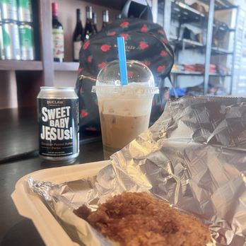 Wild Root - Gluten-free coffee cake and spicy black salted caramel iced latte, with macadamia milk and non-dairy whip. - Coffee & Tea Near Me - Lynn Haven, Florida