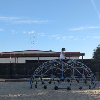 Lost Hills KOA - Climbing structure at the playground, there's a slide and swings too (not pictured) - RV Parks Near Me - Lost Hills, California Lost Hills KOA - Climbing structure at the playground, there's a slide and swings too (not pictured) - RV Parks Near Me - Lost Hills, California