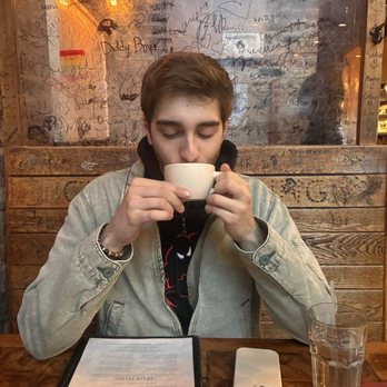Medici On 57th - Friend with my cappuccino, featuring the booth decor :) - Bakeries Near Me - Chicago, Illinois Medici On 57th - Friend with my cappuccino, featuring the booth decor :) - Bakeries Near Me - Chicago, Illinois