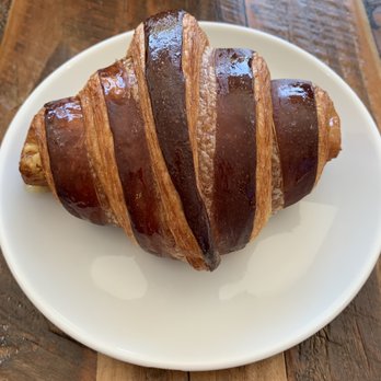 Ruby’s Bakery and Café - Croissant painted with chocolate hiding a tasty dollop of raspberry filling. - Cafes Near Me - Lodi, California Ruby’s Bakery and Café - Croissant painted with chocolate hiding a tasty dollop of raspberry filling. - Cafes Near Me - Lodi, California