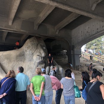Fremont Troll - To the right of the troll (the troll's left) are some homeless people!! I guess they don't like too much privacy to live here!! - Public Art Near Me - Seattle, Washington