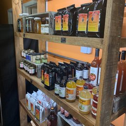 shelves of coffee and condiments shelves of coffee and condiments