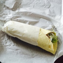 a burrito wrapped in paper a burrito wrapped in paper
