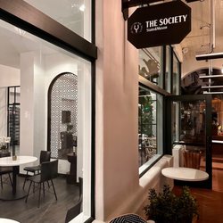 The Society: State & Mason - The Society signage with outdoor patio
