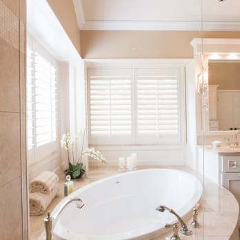 LoneStar Design Build - An expanded shower allowed for a curved bench wrapping into the corner of the shower. - General Contractors Near Me - Grapevine, Texas
