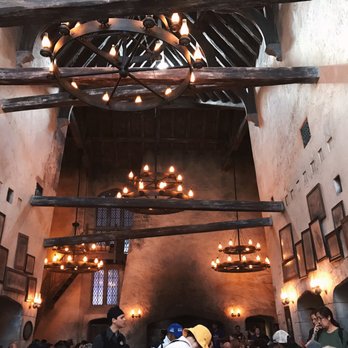 Leaky Cauldron™ - High vaulted ceilings and the cute crookedly arranged pictures on the wall - British Near Me - Orlando, Florida Leaky Cauldron™ - High vaulted ceilings and the cute crookedly arranged pictures on the wall - British Near Me - Orlando, Florida
