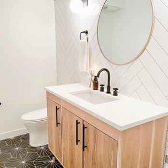 River City Tile Company - a bathroom with a sink and mirror - Building Supplies Near Me - Edmonton, Alberta River City Tile Company - a bathroom with a sink and mirror - Building Supplies Near Me - Edmonton, Alberta